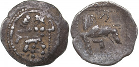 Lykaonia - Laranda AR Obol (circa 324/3 BC)
0.64 g. 14mm. VF/VF Baaltars seated left, holding grain ear, grape bunch, and sceptre. / Forepart of wolf ...