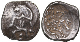 Lykaonia - Laranda AR Obol (circa 324/3 BC)
0.57 g. 10mm. VF/AU Baaltars seated left, holding grain ear, grape bunch, and sceptre. / Forepart of wolf ...