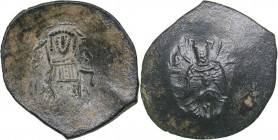 Byzantine - Constantinople Æ Trachy (1204-1261 AD)
2.74 g. 25mm. VF/VF The Theotokos enthroned facing / Emperor standing facing, holding labarum and a...