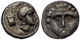 Pisidia. Selge ( Silver. 0.89 g. 1 mm ) circa 250-190 BC. Obol AR 
Facing gorgoneion.
Rev: Helmeted head of Athena right; astragalos to left.
SNG Ashm...