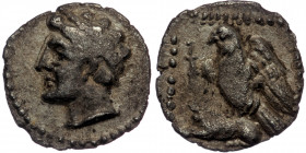 CILICIA. Uncertain mint. ( Silver. 0.53 g. 12 mm) Ca. 4th century BC. AR obol
Male head left, wreathed in grain ears.
Rev: Eagle standing left, wings ...