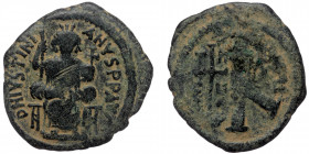 Justinian I. ( Bronze. 8.10 g. 27 mm)527-565. AE half follis Antioch mint.
DN IVSTINIANVS PP AVG, Justinian seated facing, holding long scepter and gl...