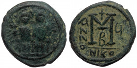 Justin II and Sophia ( Bronze. 13.14 g. 31 mm) AD 565-578. Nikomedia Follis 
Justin and Sophia seated facing on double throne,
Rev: Large M, cross abo...