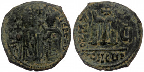 Phocas with Leontia, ( Bronze. 9.01 g . 23 mm) (Antiochia) , 602-610. Follis 
Phocas standing facing, holding globus cruciger. Leontia standing facing...