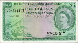 BRITISH CARIBBEAN TERRITORIES. The British Caribbean Territories Eastern Group. 5 Dollars, 1963. P-9c. Extremely Fine.

The reverse includes the fou...