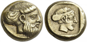 Lesbos, Mytilene 
Hecte circa 454-427, EL 2.52 g. Head of bearded god r. (Priapus) hair bound with only partially visible band. Rev. Female head r. (...