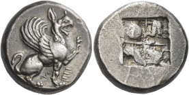Teos 
Stater circa 520-550, AR 11.88 g. Griffin seated r., l. forepaw raised; at sides of its r. foreleg, M – E. Rev. Irregular quadripartite incuse ...