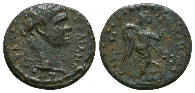 Roman Provincial, Trajan. A.D. 98-117. AE. Radiate head of Trajan right / Nike a...