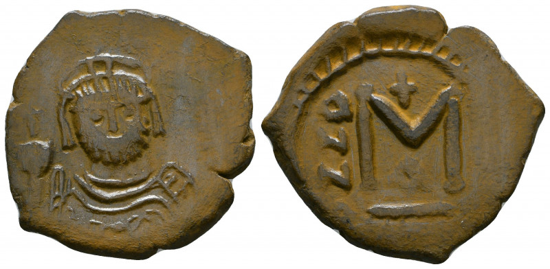 Heraclius AE Follis. AD 610-641. 

Weight: 10.2 gr
Diameter: 29 mm