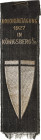 Medaillen und Abzeichen
 Stoffband 1927. Kolonialtagung 1927 in Königsberg i.Pr. 115 x 35 mm. Mit Nadel. Revers: Kruse & Söhne AG Barmen Vorzüglich...