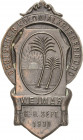 Medaillen und Abzeichen
 Metallabzeichen 1930. Deutscher Kolonialkriegerbund 6.-8. Sept. 1930. 2 Palmen vor aufgehender Sonne. 55,5 x 31 mm, 6 g Ties...
