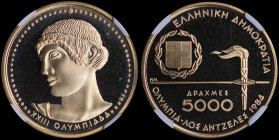 GREECE: 5000 Drachmas (1984) in gold (0,900) commemorating the XXIII Los Angeles Olympic Games 1984 with national Arms and torch. God Apollo on revers...