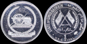 UMM AL QAIWAIN / U.A.E: 1 Riyal (AH1389 / 1970) in silver (1,000) with dates within crossed flags and sprigs within circle. Old cannon within wreath o...