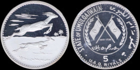 UMM AL QAIWAIN / U.A.E: 5 Riyals (1970) in silver (1,000) with dates within crossed flags and sprigs at left and right within circle. Two gazelles on ...