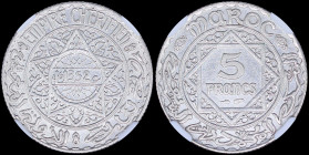 MOROCCO: 5 Francs (AH1352 / 1933) in silver (0,680) with date within small circle of doubled tri-lobe star, all within circle. Value within doubled sq...