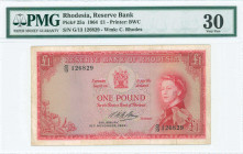 RHODESIA: 1 Pound (16.11.1964) in red on multicolor unpt with Queen Elizabeth II at right. S/N: "G/13 126829". WMK: Cecil Rhodes. Printed by BWC. Insi...