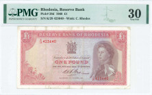 RHODESIA: 1 Pound (14.10.1968) in pale red on multicolor unpt with brown portrait of Queen Elizabeth II at right. S/N: "K/28 423640". WMK: Cecil Rhode...