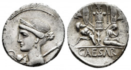Julius Caesar. Denarius. 44 BC. Galia. (Ffc-12). (Craw-468/2). (Cal-646). Anv.: Diademed head of Venus left, Cupid and lituus before, sceptre behind. ...