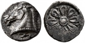 AEOLIS. Kyme. Circa 480-450 BC. Tetartemorion (Silver, 6 mm, 0.20 g). Head of horse to left; below, astragalos. Rev. Stellate floral pattern within ro...