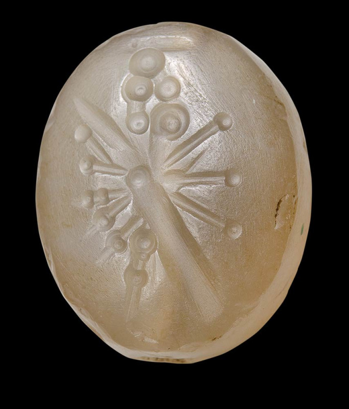 A late Babylonian chalcedony stamp seal. 

700-500 B.C.
17x21x11 mm

Oval f...