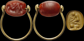 An etruscan carnelian scarab intaglio set on a modern gold ring. Male figure and animal.
