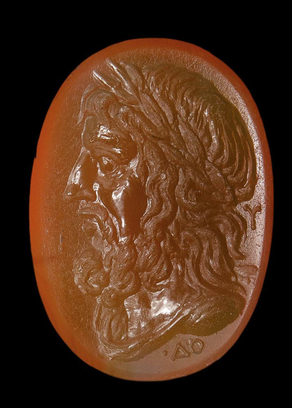 An important greek agate intaglio. Bust of Zeus with letters.

2nd century B.C...