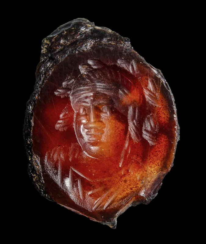 A late hellenistic agate intaglio. Bust of a Bacchus.

3rd - 2nd century B.C....