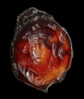 A late hellenistic agate intaglio. Bust of a Bacchus.