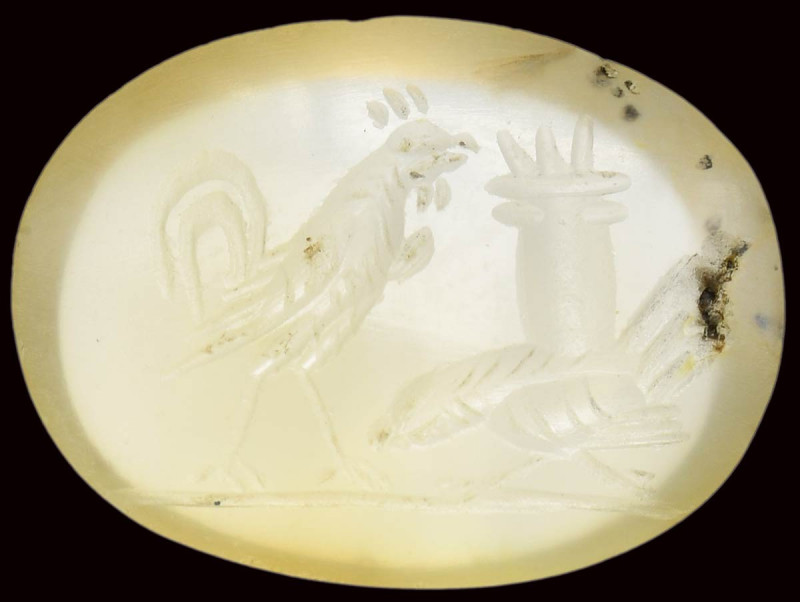 A roman chalcedony intaglio. Two cocks. 

2nd century A.D.
11x15x3 mm

One ...