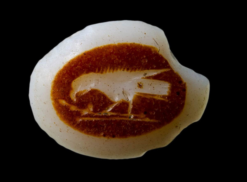 A roman double-layered agate intaglio. Bird (crow) with a leafy branch.

2nd c...