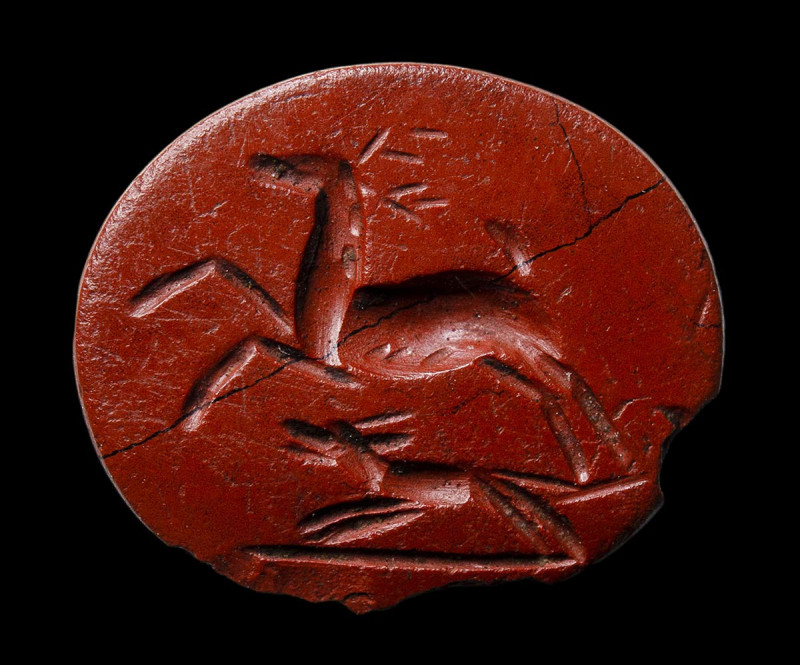 A roman red jasper intaglio. Hunting scene.

2nd - 3rd century A.D.
9x10x2 mm...