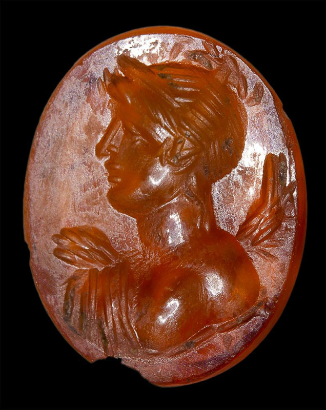 A roman carnelian intaglio. Bust of Nike. 

1st-2nd century A.D.
10x11x2 mm ...