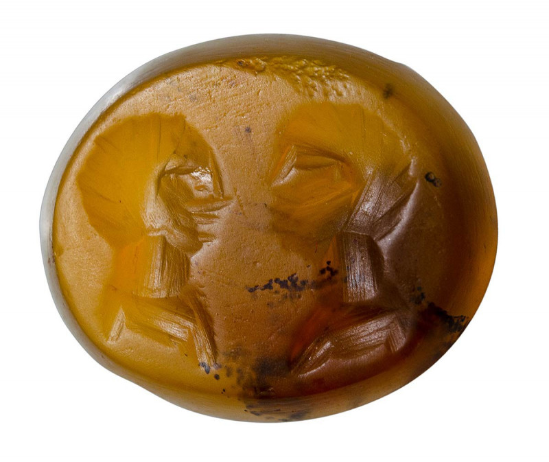 An eastern roman agate intaglio. Two male portraits. 

2nd - 3rd century A.D....