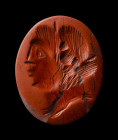 An eastern roman red jasper intaglio. Female portrait.