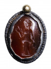 A roman silver pendant set with a carnelian intaglio. Priestress.