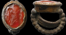 A roman carnelian intaglio mounted on a silver ring. Allegory of fortune.