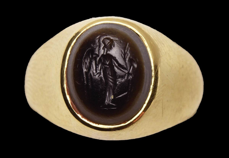 A roman two-layered agate intaglio mounted in a modern gold ring. Fortuna-Tyche....