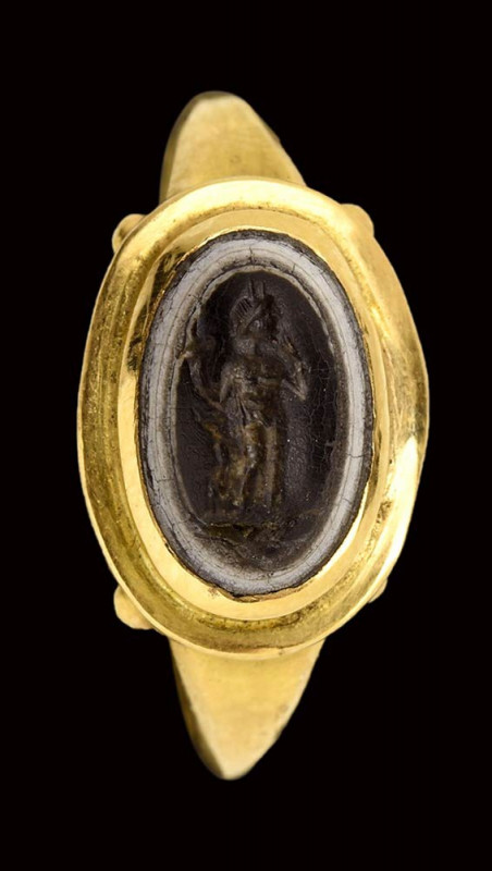 A roman three-layers agate intaglio mounted in a modern gold ring. Harpocrates. ...