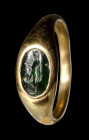 A roman green chalcedony intaglio set in a postclassical gold ring. Bonus Eventus.