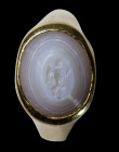 A roman agate intaglio mounted in a modern gold ring. Winged victory.