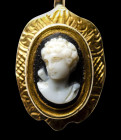A victorian gold brooch set with a renaissance onyx two-layered cameo. Bust of a Youth.