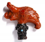 A postclassical coral stick knob with silver handle. Gryllos