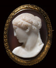 A two-layered agate cameo mounted on a gold brooch. Female bust.