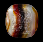 A neoclassical banded agate intaglio. Bust of Esculape.