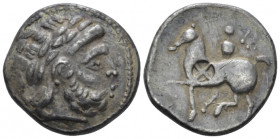 Celtic, Tetradrachm imitation of Philip II circa III century BC, AR 23.90 mm., 12.38 g.
Laureate head of Zeus r. Rev. Horseman galloping l. with smal...