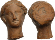 Terracotta handle fragment in the shape of a female head. Roman. 25x23x18 mm.