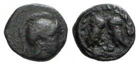 Attica, Athens, c. 322/17-307 BC. Æ (14mm, 2.72g, 6h). Helmeted head of Athena r. R/ Two owls standing confronted, heads facing, plemochoe below; all ...