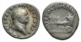Titus (Caesar, 69-79). AR Denarius (17mm, 3.27g, 4h). Rome, AD 79. Laureate head r. R/ Slow quadriga l., drawing garlanded cart containing flower. RIC...