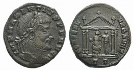 Maxentius (307-312). Æ Follis (24mm, 7.60g, 6h). Ticinum, 308-310. Laureate head r. R/ Roma seated r. within tetrastyle temple, being crowned by Victo...