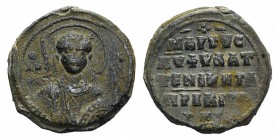 Byzantine Pb Seal, c. 7th-12th century (30mm, 23.95g, 12h). Facing bust of Saint, holding spear and shield. R/ Legend in four lines. VF